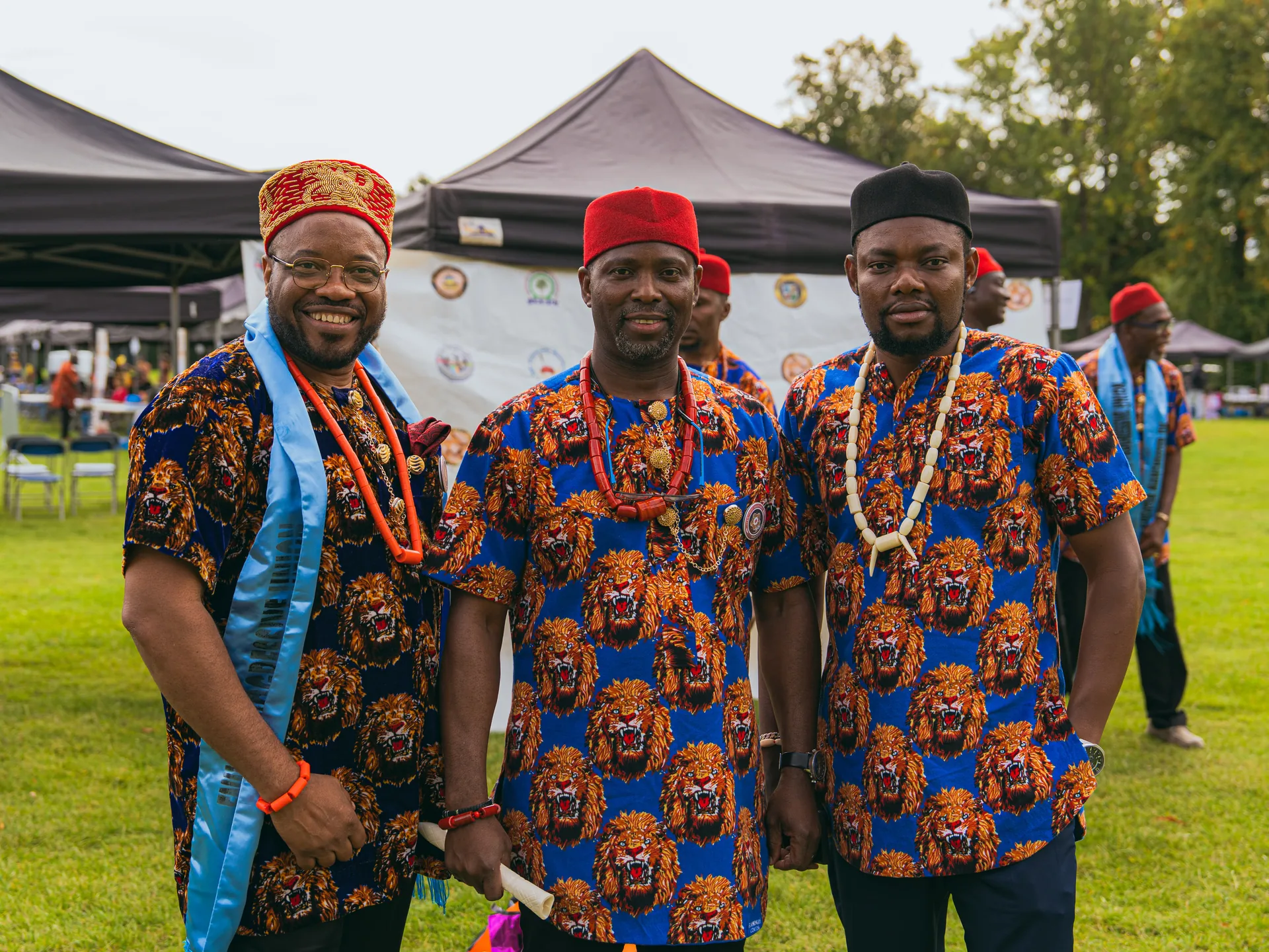 Committee members in matching traditional shirts